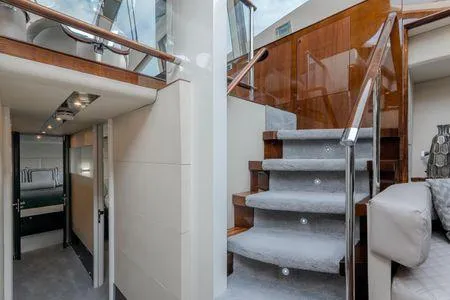 Slide: The Image of Interior of 2007 Lazzara LSX 75 yacht with modern staircase and luxurious design. - 25
