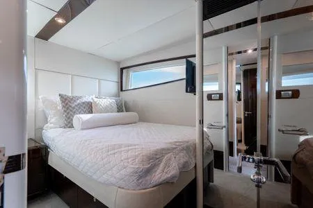 Slide: The Image of Luxurious bedroom interior of 2007 Lazzara LSX 75 yacht with modern design and elegant bedding. - 26