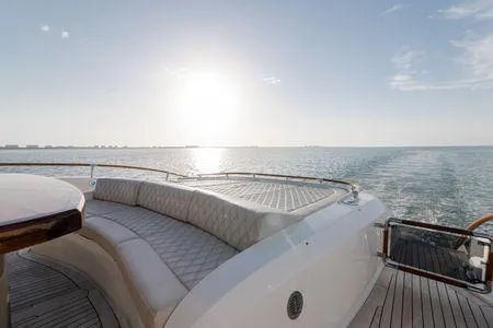 Slide: The Image of Luxurious 2007 Lazzara LSX 75 yacht deck with elegant seating, ocean view, and sunset. - 28