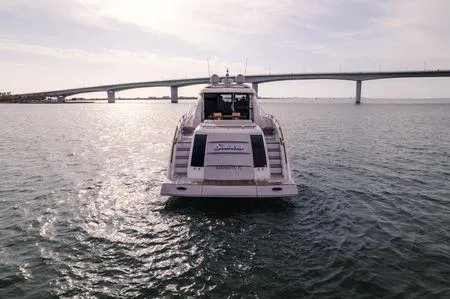 Slide: The Image of 2007 Lazzara LSX 75 yacht on water with bridge in background. - 3