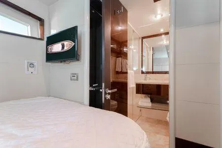 Slide: The Image of Luxurious 2007 Lazzara LSX 75 yacht interior with modern bedroom and bathroom. - 39