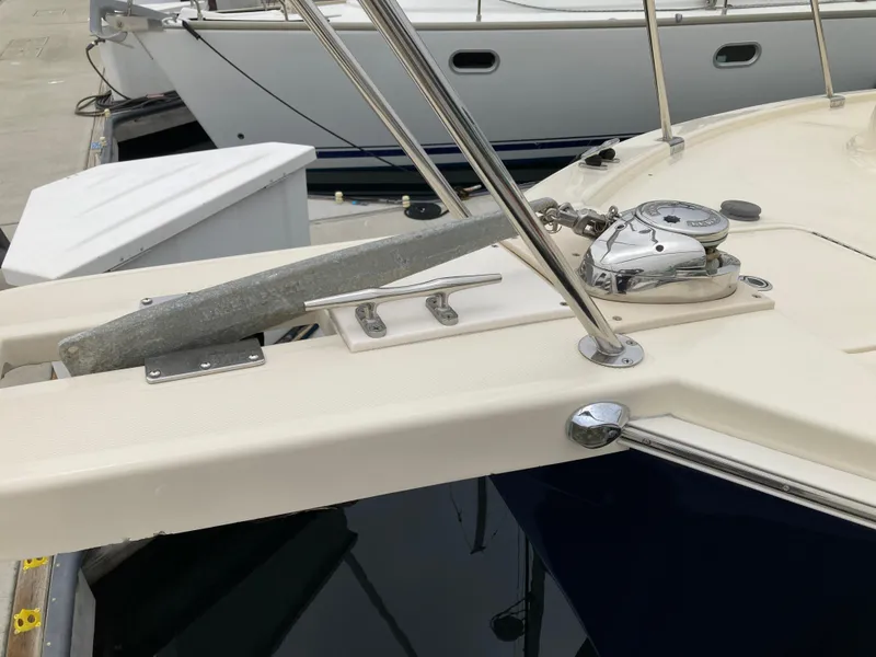 Slide: The Image of 2004 Mainship Pilot 34 boat deck with anchor and winch system. - 15