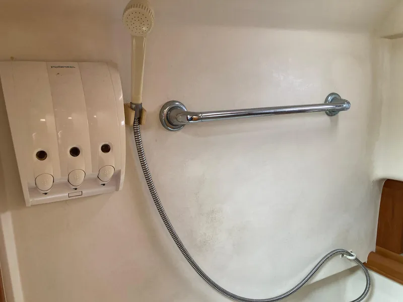 Slide: The Image of Shower area in 2004 Mainship Pilot 34 boat with dispenser and grab bar. - 39