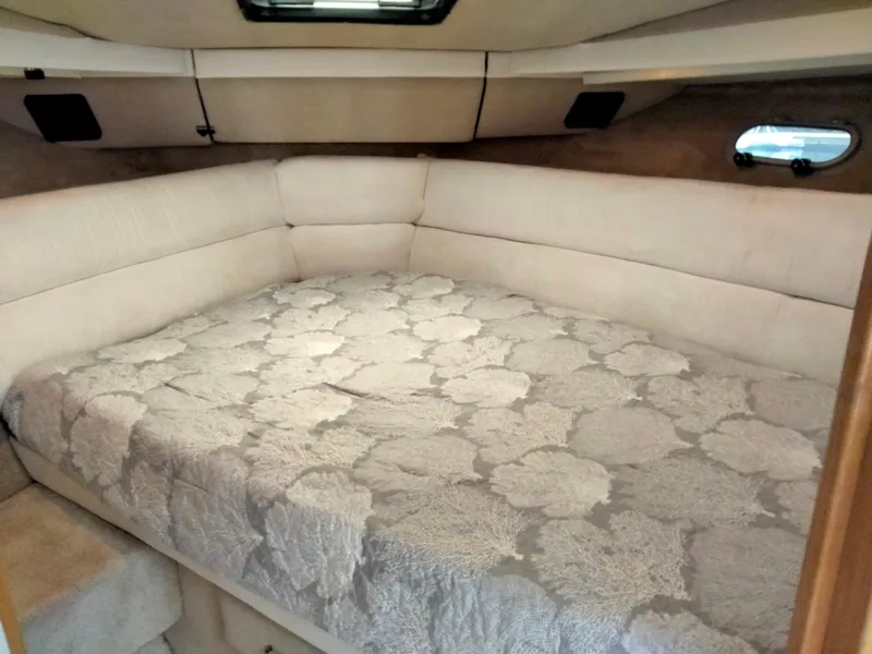 Slide: The Image of 1990 Bayliner 4387 Aft Cabin interior with cozy bed and elegant decor. - 12