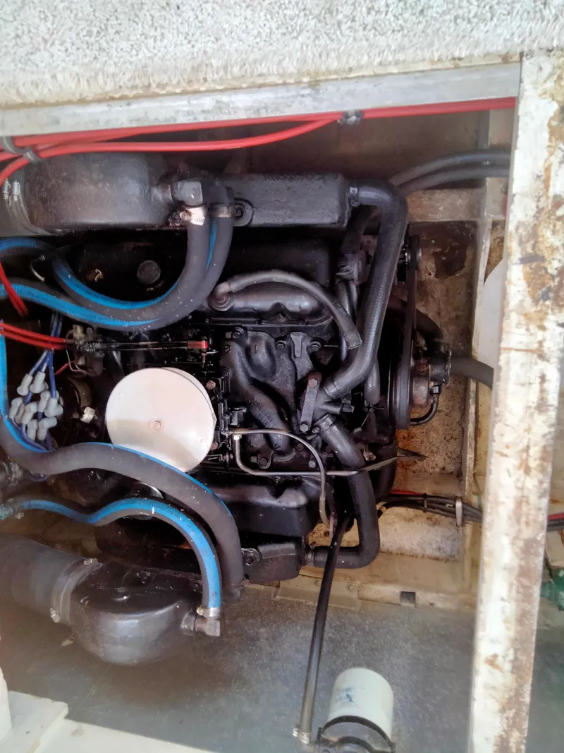 Slide: The Image of Engine compartment of a 1990 Bayliner 4387 Aft Cabin boat, showing detailed mechanical components. - 20