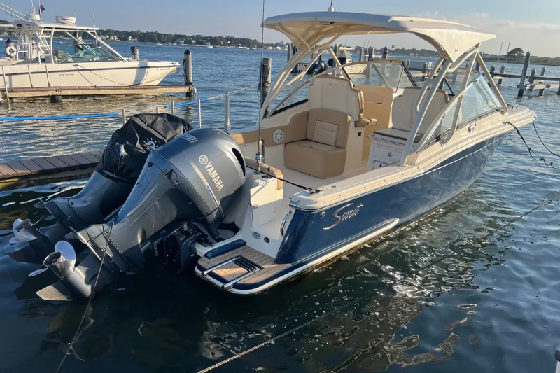 Slide: The Image of 2020 Scout 255 Dorado boat docked with Yamaha outboard motor. - 32