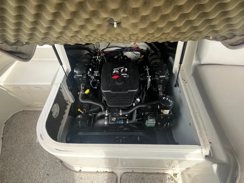 Slide: The Image of Engine compartment of a 2004 Sea Ray 220 Sundeck boat, showcasing a 5.0 MPI engine. - 22