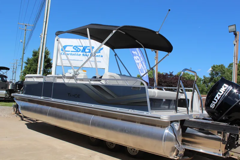 Slide: The Image of 2025 Tahoe Pontoon Sport 85 Versatile Rear Bench with Suzuki motor, displayed outdoors. - 3