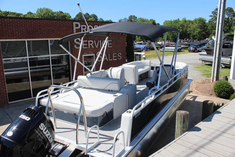 Slide: The Image of 2025 Tahoe Pontoon Sport 85 Versatile Rear Bench at dealership, featuring spacious seating and Suzuki engine. - 4