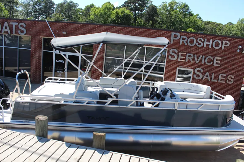 Slide: The Image of 2025 Tahoe Pontoon Sport 85 Versatile Rear Bench at dealership, featuring sleek design and canopy. - 5