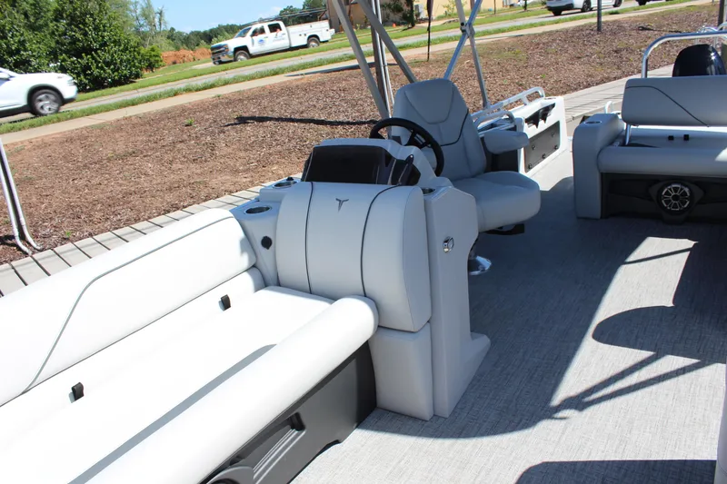 Slide: The Image of 2025 Tahoe Pontoon Sport 85 Versatile Rear Bench interior with steering console and seating. - 9