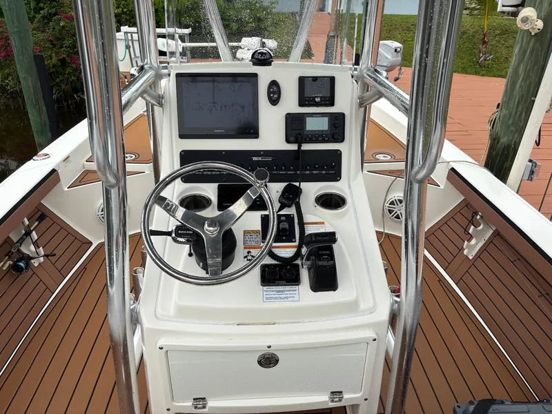 Slide: The Image of 2020 Pathfinder 2600 HPS boat console with steering wheel and navigation controls. - 13