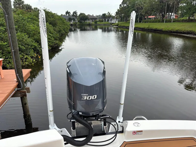 Slide: The Image of 2020 Pathfinder 2600 HPS boat with Yamaha 300 engine on a calm river. - 15