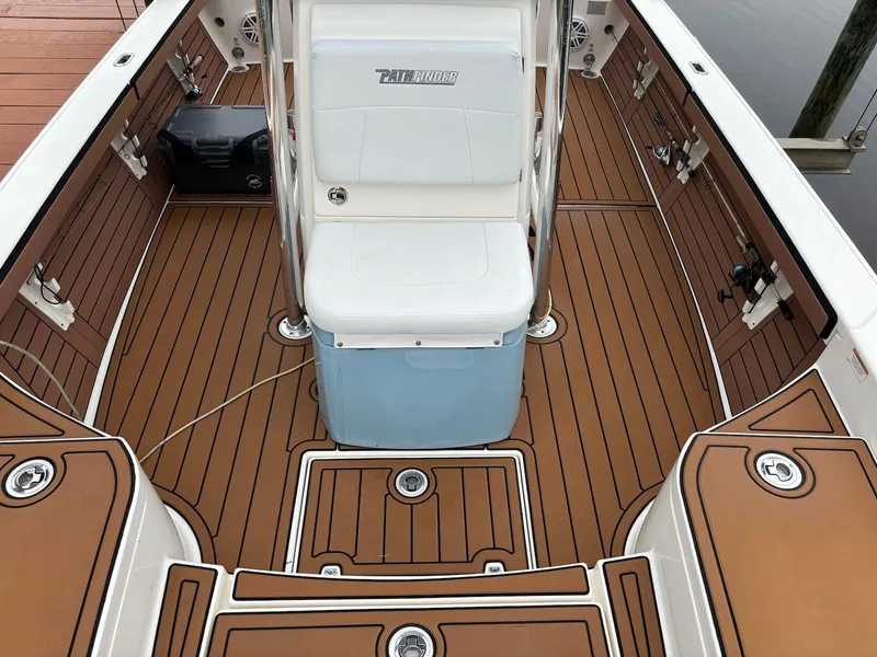 Slide: The Image of 2020 Pathfinder 2600 HPS boat interior with teak-style flooring and seating. - 18