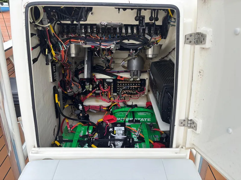 Slide: The Image of 2020 Pathfinder 2600 HPS boat electrical compartment with wiring and batteries. - 23