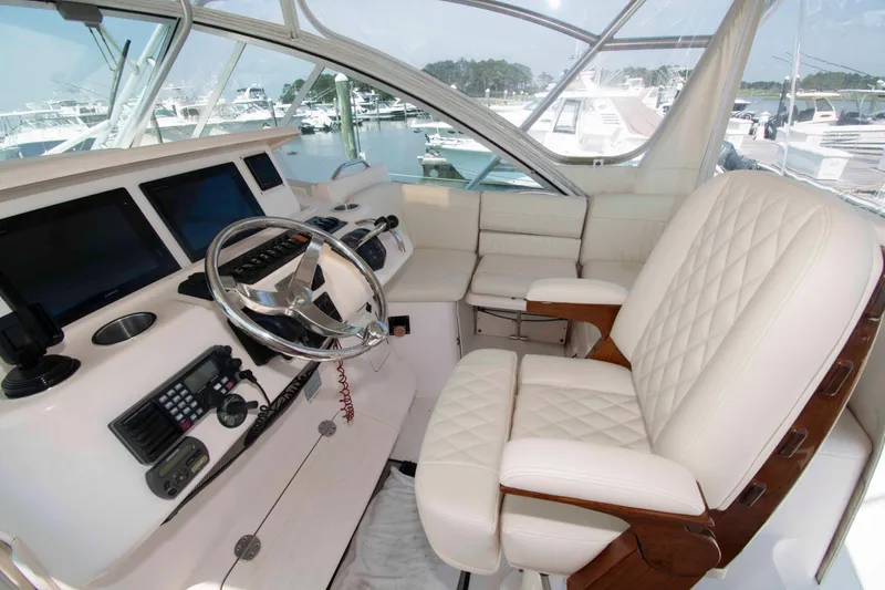 Slide: The Image of Luxurious helm of 2006 Grady-White Express 360 boat with plush seating and advanced controls. - 10