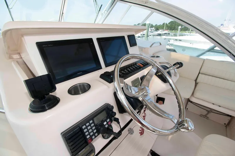 Slide: The Image of 2006 Grady-White Express 360 helm with dual displays and steering wheel. - 12