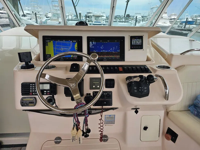 Slide: The Image of Helm of 2006 Grady-White Express 360 with navigation screens and controls. - 14