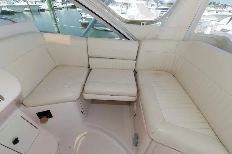 Slide: The Image of Luxurious seating area on a 2006 Grady-White Express 360 boat, docked at a marina. - 15