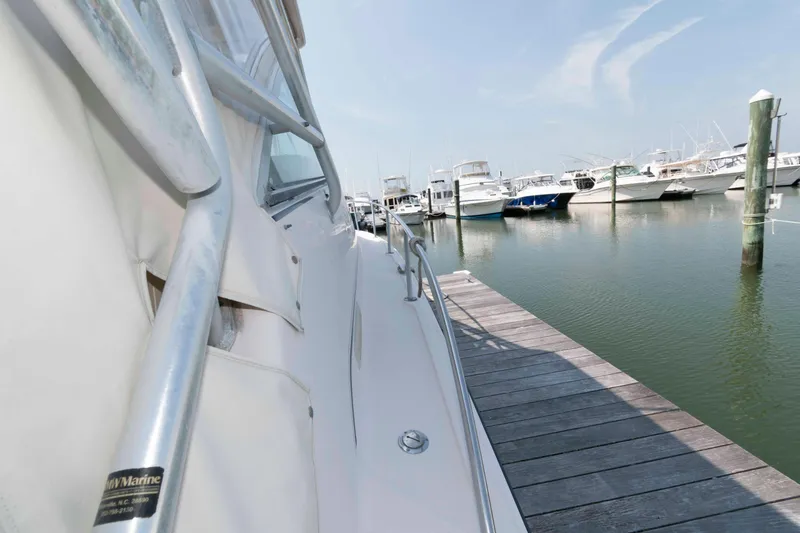 Slide: The Image of 2006 Grady-White Express 360 docked at a marina with other boats. - 16
