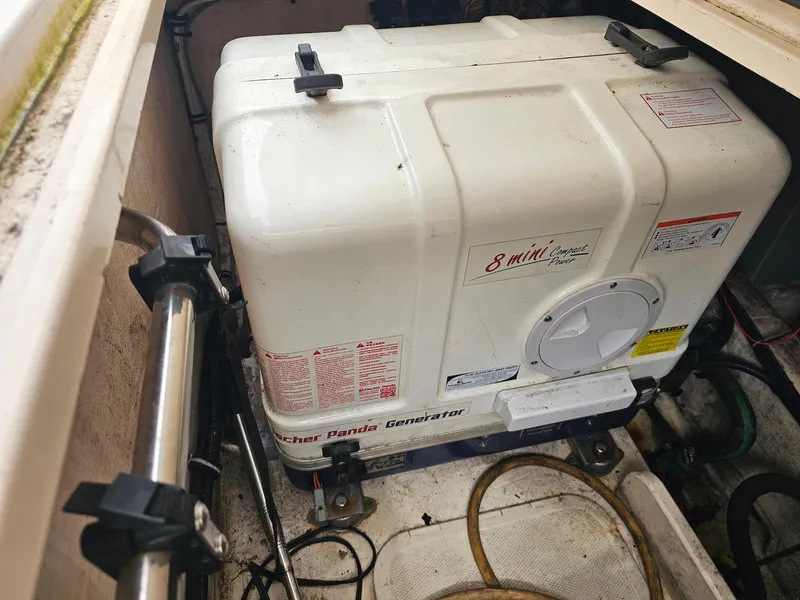 Slide: The Image of 2006 Grady-White Express 360 boat engine compartment with Fischer Panda generator. - 28