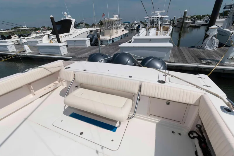 Slide: The Image of 2006 Grady-White Express 360 boat docked at marina with triple outboard engines. - 7