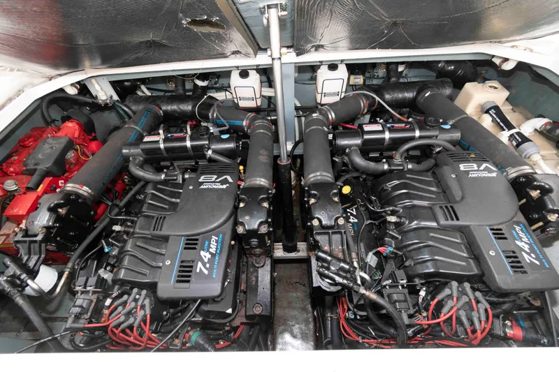 Slide: The Image of Engine compartment of a 2001 Sea Ray 340 Sundancer with twin V8 engines. - 14