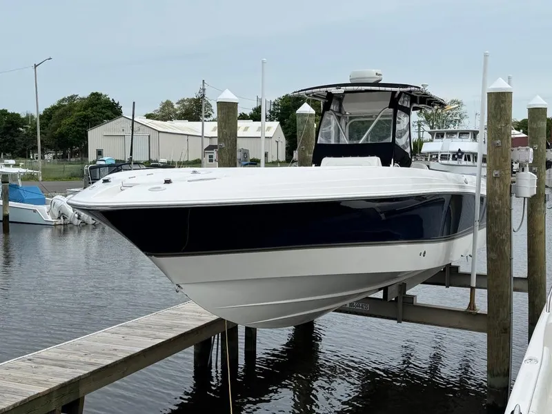 The Image of 2004 Wellcraft Scarab Fisherman CCF 35 boat docked at marina. - 0