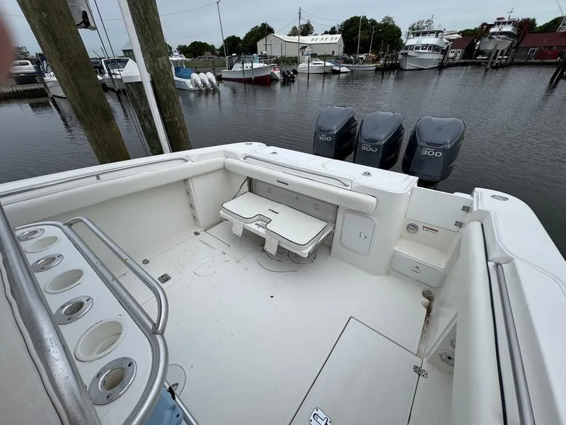 Slide: The Image of 2004 Wellcraft Scarab Fisherman CCF 35 boat with triple engines docked at marina. - 15