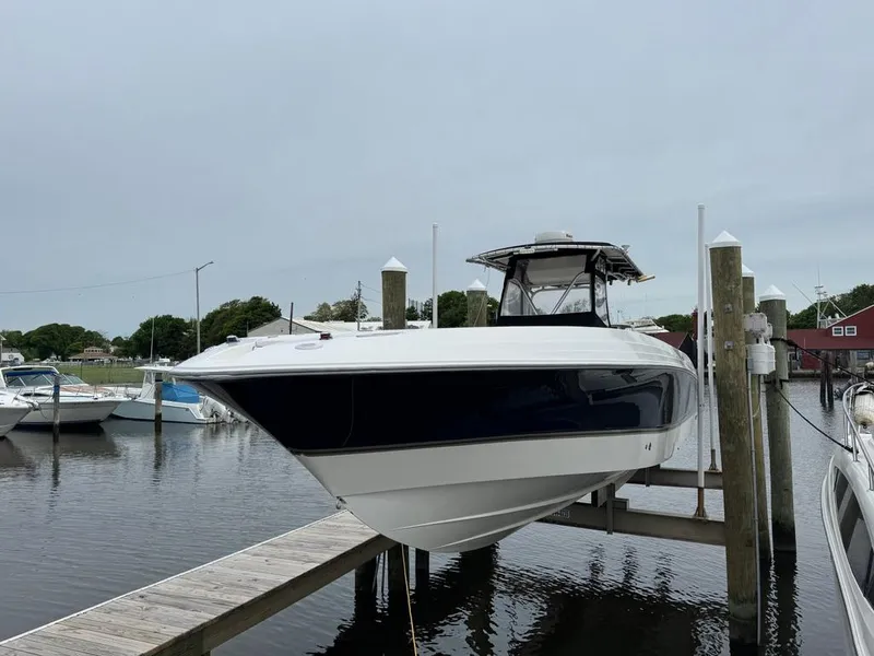 Slide: The Image of 2004 Wellcraft Scarab Fisherman CCF 35 boat docked at marina. - 2