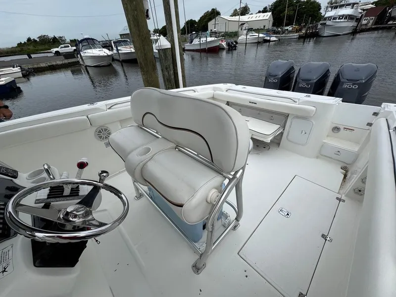 Slide: The Image of 2004 Wellcraft Scarab Fisherman CCF 35 boat interior with steering wheel and seating. - 21