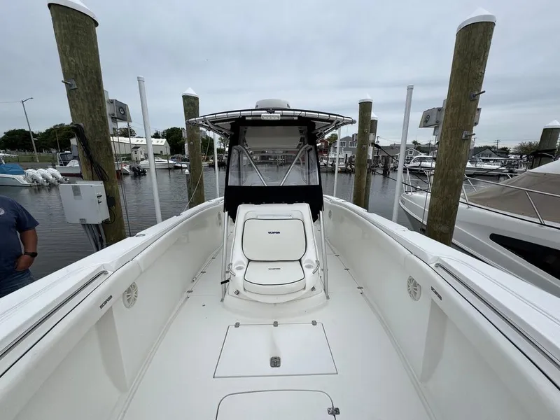 Slide: The Image of 2004 Wellcraft Scarab Fisherman CCF 35 boat docked at marina, showcasing spacious deck. - 4