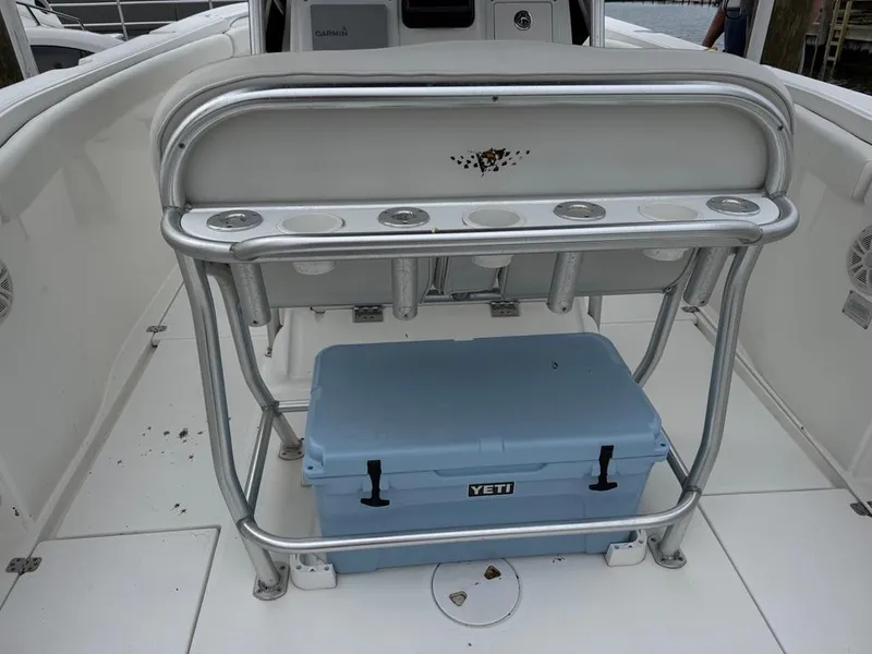 Slide: The Image of 2004 Wellcraft Scarab Fisherman CCF 35 boat interior with rod holders and Yeti cooler. - 8