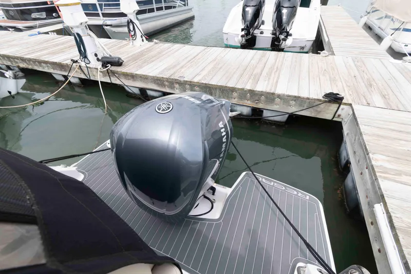Slide: The Image of 2019 Regal 26 XO boat with Yamaha outboard engine docked at marina. - 3