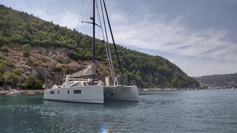 Slide: The Image of Sleek 2011 Performance Catamarans 52 sailing in scenic coastal waters. - 13