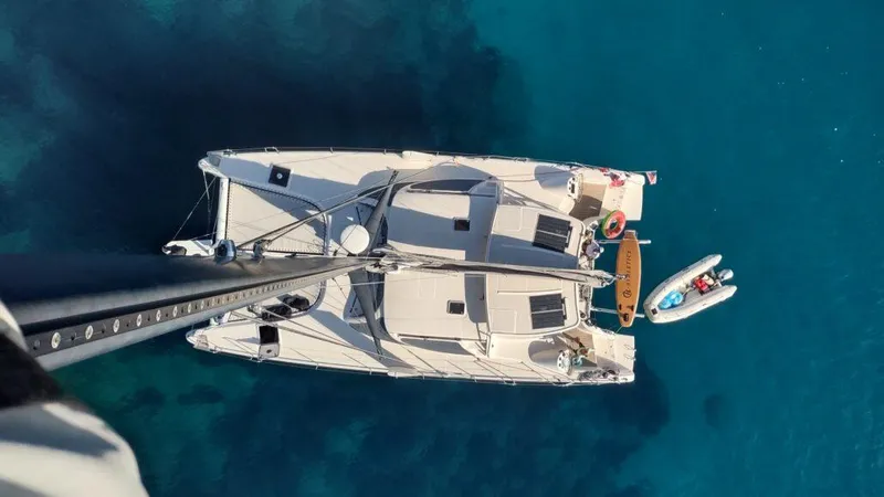 Slide: The Image of Aerial view of 2011 Performance Catamarans 52 on clear blue water. - 16