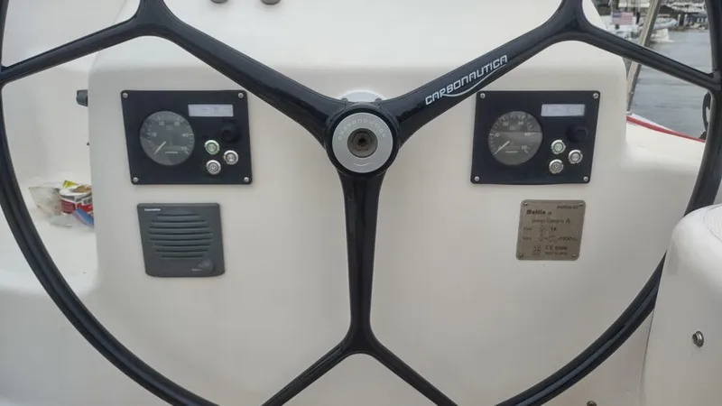 Slide: The Image of Steering wheel and gauges of a 2011 Performance Catamarans 52 sailboat. - 20
