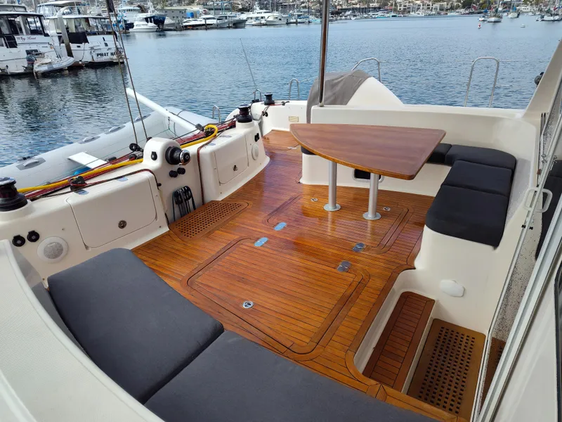 Slide: The Image of Luxurious 2011 Performance Catamarans 52 with teak deck and seating, docked at marina. - 27