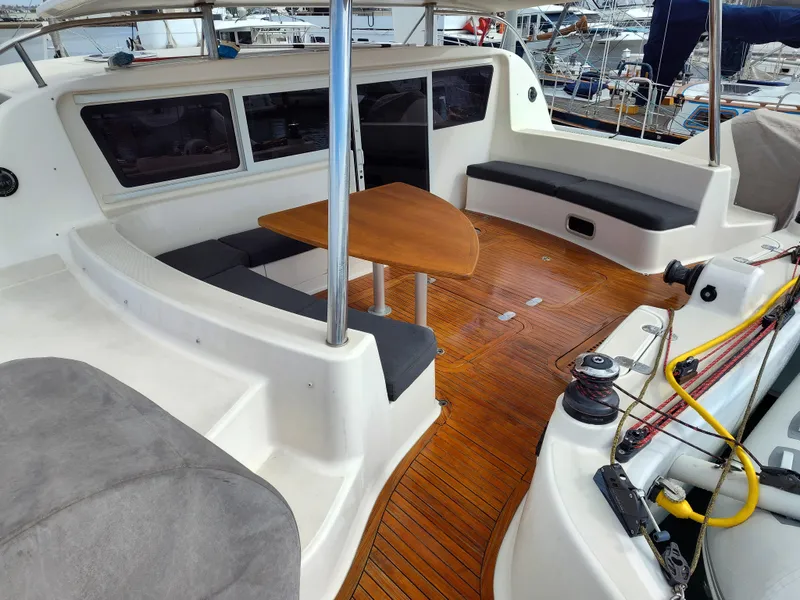 Slide: The Image of Spacious 2011 Performance Catamarans 52 cockpit with seating, table, and teak flooring. - 31