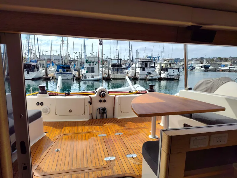 Slide: The Image of Luxurious 2011 Performance Catamarans 52 with wooden deck, docked at a marina. - 35