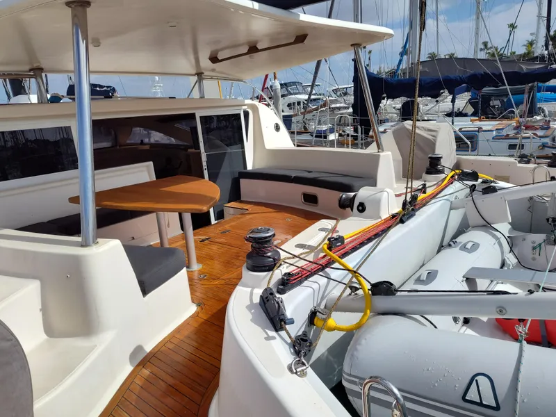 Slide: The Image of 2011 Performance Catamarans 52 with spacious deck and seating area in marina setting. - 41