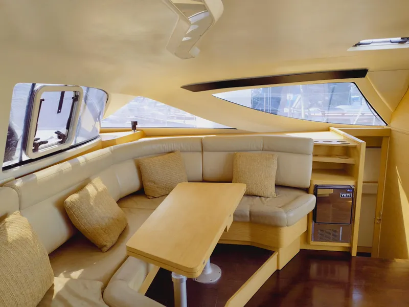 Slide: The Image of Luxurious interior of a 2011 Performance Catamarans 52, featuring a cozy seating area and table. - 43