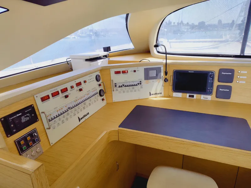 Slide: The Image of Control panel of a 2011 Performance Catamarans 52, featuring navigation and monitoring systems. - 45