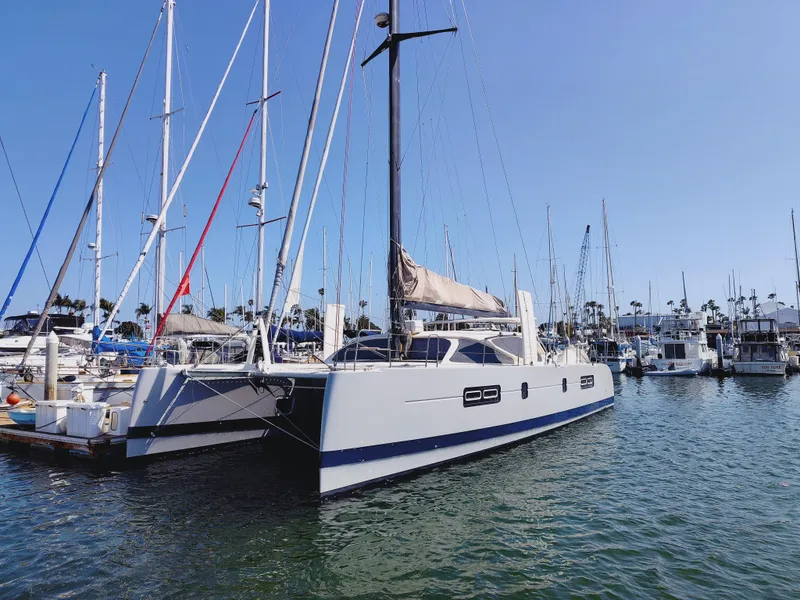 Slide: The Image of 2011 Performance Catamarans 52 docked in a marina under clear blue skies. - 5
