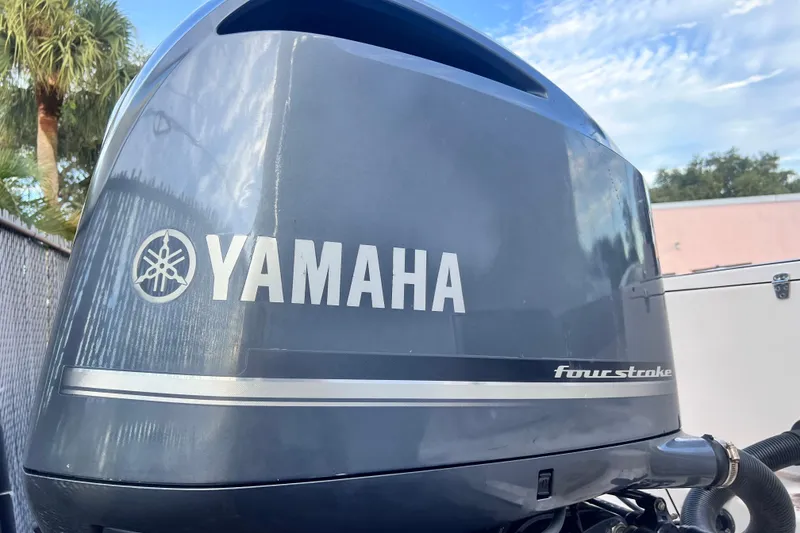 Slide: The Image of Yamaha four-stroke engine on 2003 Grady-White Advance 257 boat, outdoor setting. - 2