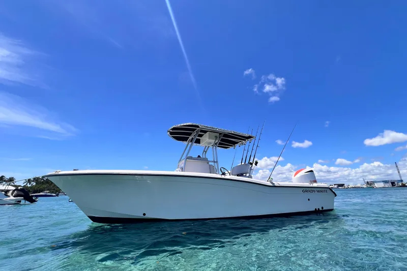 Slide: The Image of 2003 Grady-White Advance 257 boat on clear blue water under a sunny sky. - 4