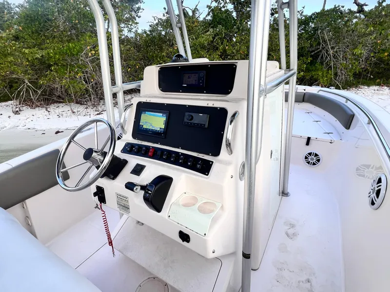 Slide: The Image of 2003 Grady-White Advance 257 boat console with steering wheel and navigation system. - 6