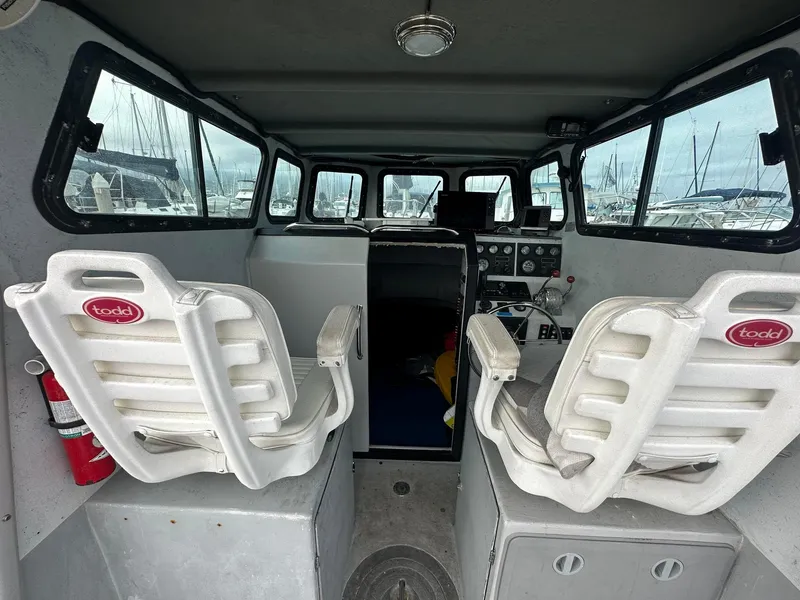 Slide: The Image of Interior of a 1987 Radon 26 boat with Todd seats and control panel. - 10