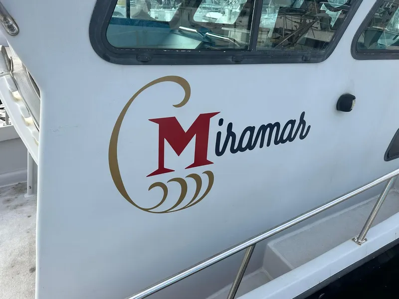 Slide: The Image of 1987 Radon 26 boat with "Miramar" logo on the side. - 7