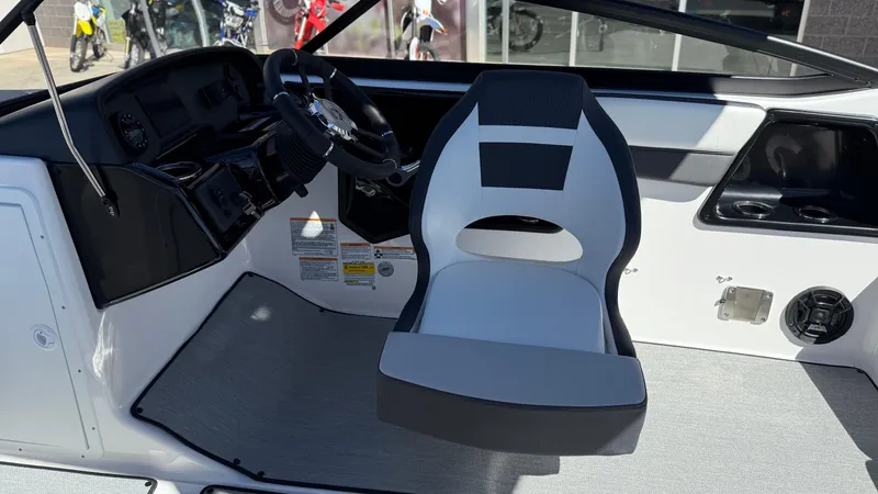 Slide: The Image of 2025 Yamaha AR195 boat interior with steering wheel and captain's seat. - 30
